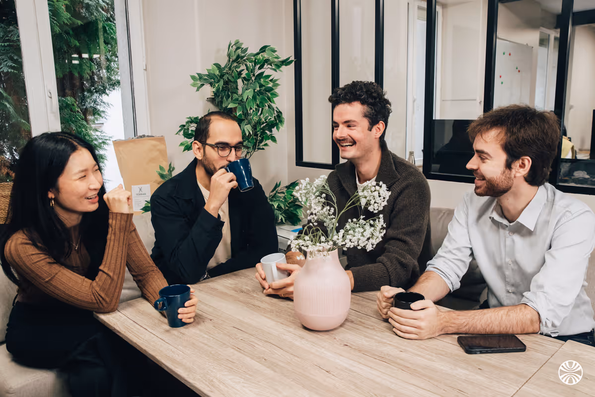 Korint colleagues chatting over coffee
